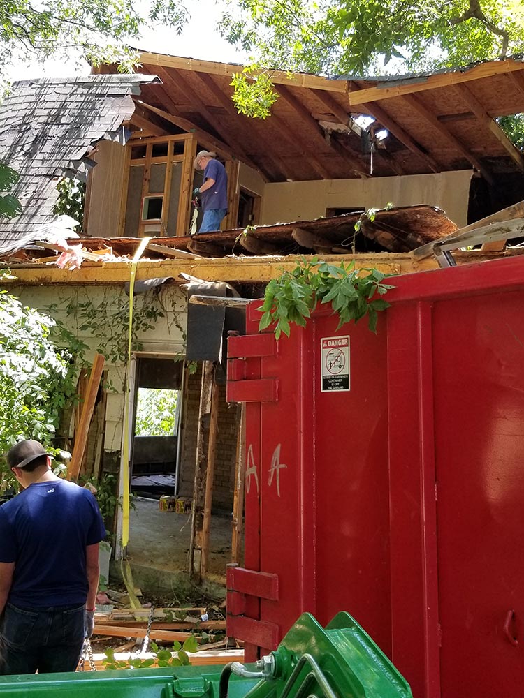 Tearing down old structures to make way for Cozy Acre