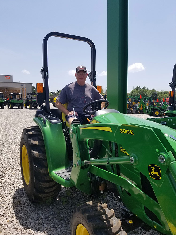 Our new John Deere tractor, ready for work creating Cozy Acre